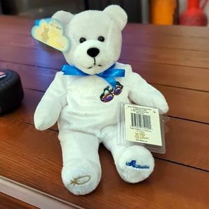 - Holy Bears . White bear with swimming goggles on chest .